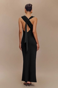 Detail of elegant backless black maxi dress featuring a crisscross knotted strap design