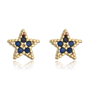 Macro shot of 18K gold star stud earrings with micro-set dark blue zircon stones