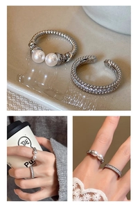 Detail of twisted silver ring with double pearls and sparkling zircon pavé band