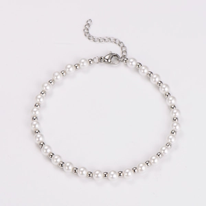 Macro detail of faux pearl and silver metal bead bracelet with lobster clasp