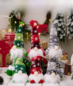 Detail of Christmas gnomes with snowflake knitted hats and plush beards in a festive setting