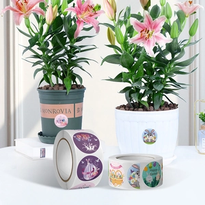 Roll of colorful Easter stickers featuring cartoon bunnies and eggs in a cozy home setting