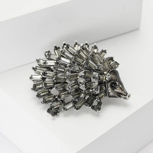 Cartoon alloy hedgehog brooch with silver metal base and gray rectangular crystals