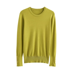 Slim fit long sleeve lime green knit top featuring golden buttons on the sleeve cuffs