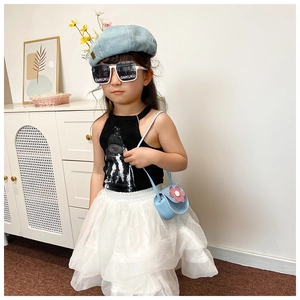 Cute girl fashion outfit with floral crossbody bag and blue beret for summer outings