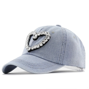 Distressed denim baseball cap with rhinestone heart and pearl fringe pendants