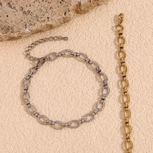 Detail of minimalist 14K gold and silver plated stainless steel anklet with lobster clasp