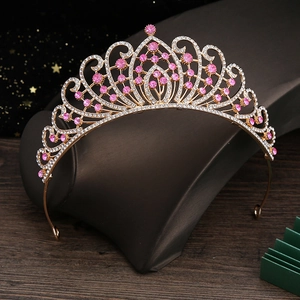 Detailed view of alloy bridal crown featuring pink gemstones and shimmering rhinestones