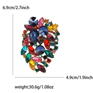 Vintage gold alloy brooch with colorful rhinestones and crystals measuring 6.9cm by 4.9cm