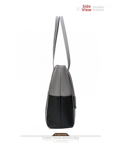 Detail view of large tote bag with grey and black PU leather stitching and thin shoulder straps