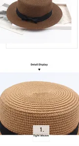 Détails du tissage serré d'un chapeau de paille avec ruban gros-grain et nœud noir