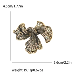 Vintage gold bow brooch with champagne rhinestones and product size measurements