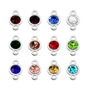Detailed grid of 12-color crystal rhinestones with silver alloy double loops for DIY jewelry