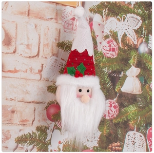 Detail of Santa Claus hanging ornament on Christmas tree with knitted fabric textures