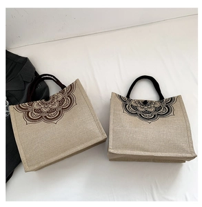 Linen tote bags with ethnic mandala prints in brown and black color schemes