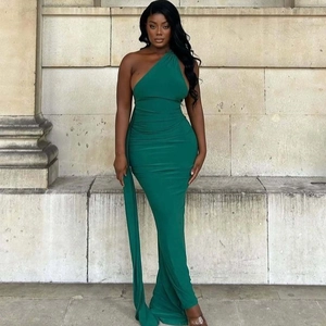 Detail of dark green one-shoulder evening dress with slimming fit and elastic fabric