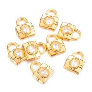 Detailed view of eight gold plated lock pendants with sparkling zircon stone inlays