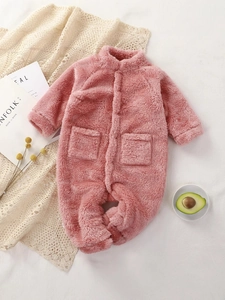 Soft pink plush baby romper for winter warmth, newborn onesie with front pockets