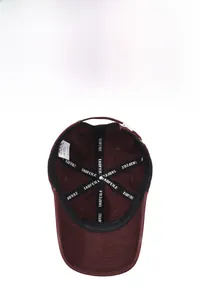 Detail of soft cotton baseball cap interior with breathable sweatband and metal buckle