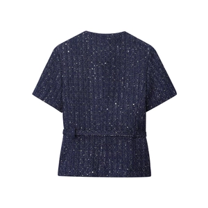 Vista posteriore della giacca in tweed blu navy con paillettes e vita sciancrata