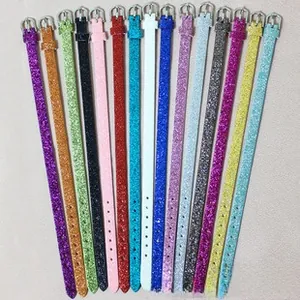 Detailed flat lay of multi-colored glitter PU leather straps with silver metal buckles