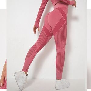 Rear view of pink seamless knit yoga set showing texture and compression fit