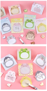 Detail view of colorful cartoon animal sticky notes including penguin pig and frog designs