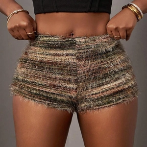 Macro detail of textured fuzzy knit shorts in olive and brown earth tone stripes