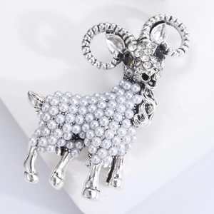 Elegant silver ram brooch featuring white pearls and sparkling rhinestone embellishments
