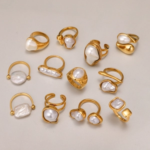 Set of 11 gold titanium steel rings featuring various white pearls in elegant designs