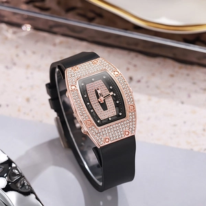 Luxury tonneau-shaped iced out watch with rose gold case and black silicone strap