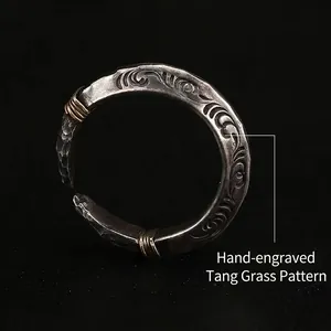 Vintage handmade spearhead open ring with hand-carved Tang Grass pattern in silver and brass