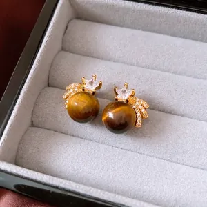 Star-shaped 18K gold plated tiger eye stud earrings with sparkling cubic zirconia accents
