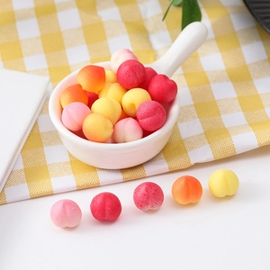Mini TPR peach squishy stress relief toys in colorful pink and yellow fruit shapes