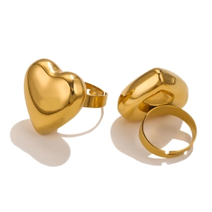 Detailed view of polished 18K gold plated heart rings with adjustable open band design