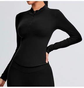 Detail view of slim fit black half-zip yoga top with high-stretch quick-dry fabric