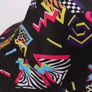 Close-up of geometric patchwork and animal print texture on a vintage cotton bucket hat