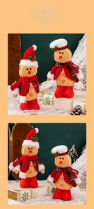 Detailed close-up of standing gingerbread plush dolls with red hats and festive scarves