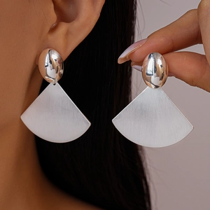Polished silver fan-shaped geometric earrings with a modern brushed metallic finish
