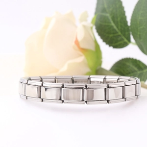 Modular stainless steel Italian charm bracelet with a polished mirror finish on white background