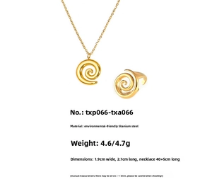 Detail view of golden spiral pendant and open ring set with size and material dimensions