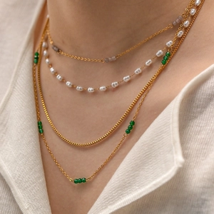 Layered 18K gold plated stainless steel necklace with white pearls and green beads