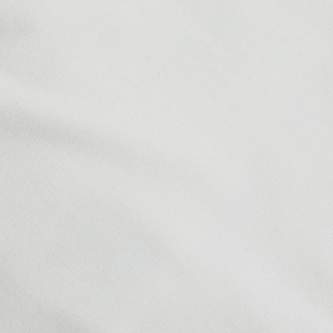 Macro shot of white knitted fabric texture showing fine weave and soft cotton material