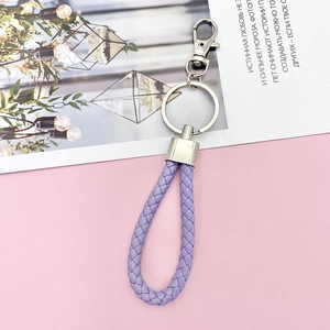 Light purple braided leather keychain with silver polished metal hook and ring detail