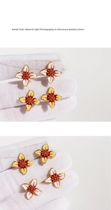 Macro shot of handmade enamel four-petal flower earrings with intricate bead textures
