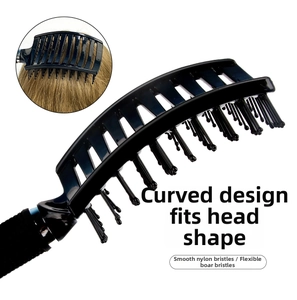 Close-up of curved detangling hairbrush with nylon pins and boar bristles for scalp massage