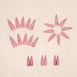 Pink press-on nail set featuring glitter accents and white star patterns in long almond shape