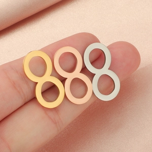 Polished stainless steel infinity symbol pendants in gold, rose gold, and silver finishes