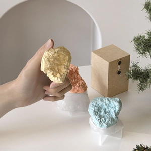 Detailed view of 3D rock resin crystals in yellow, pink and blue for DIY stone decor