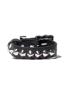 Detail of black leather punk bracelet with silver conical metal studs and D-ring